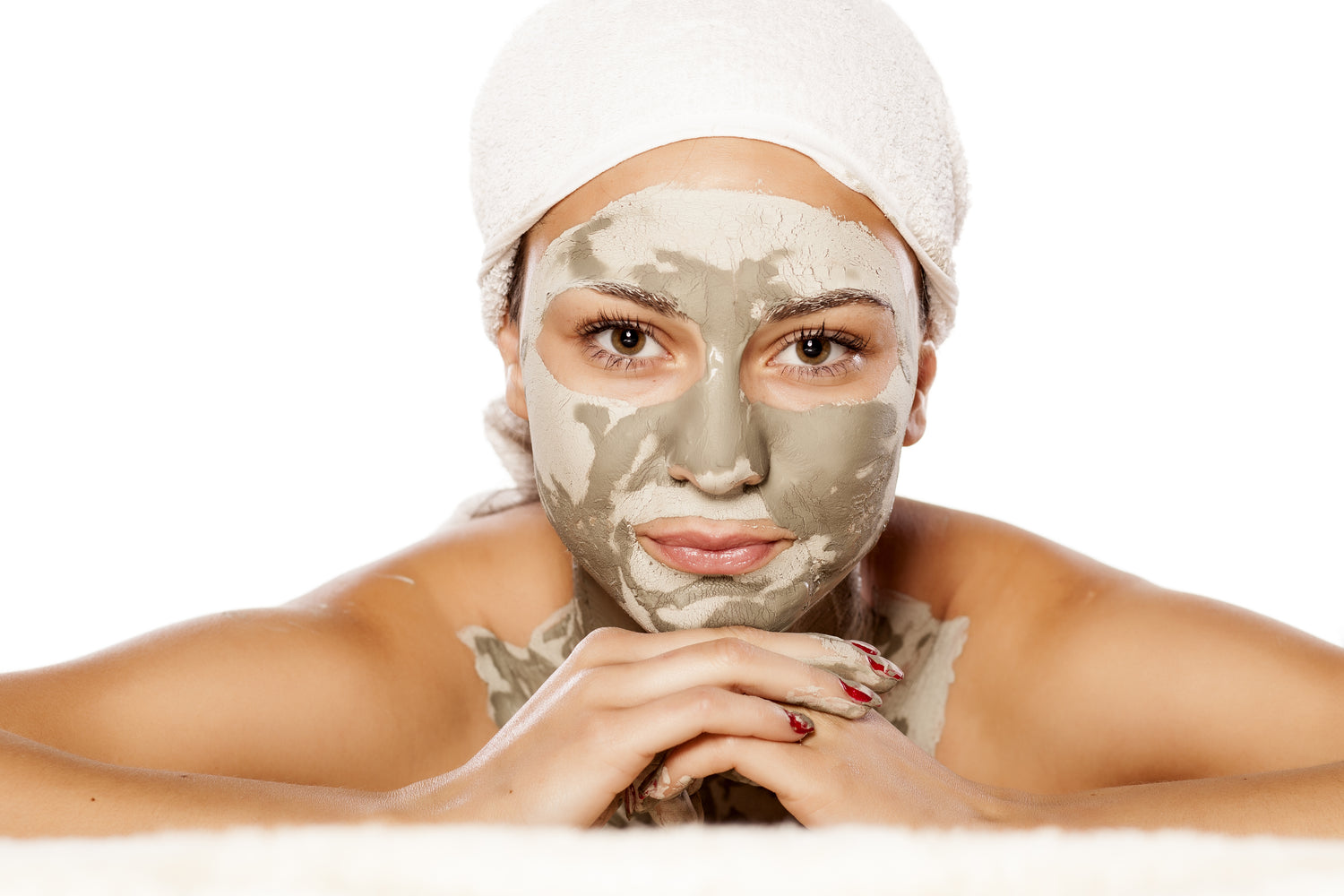 woman with a clay mask on her face