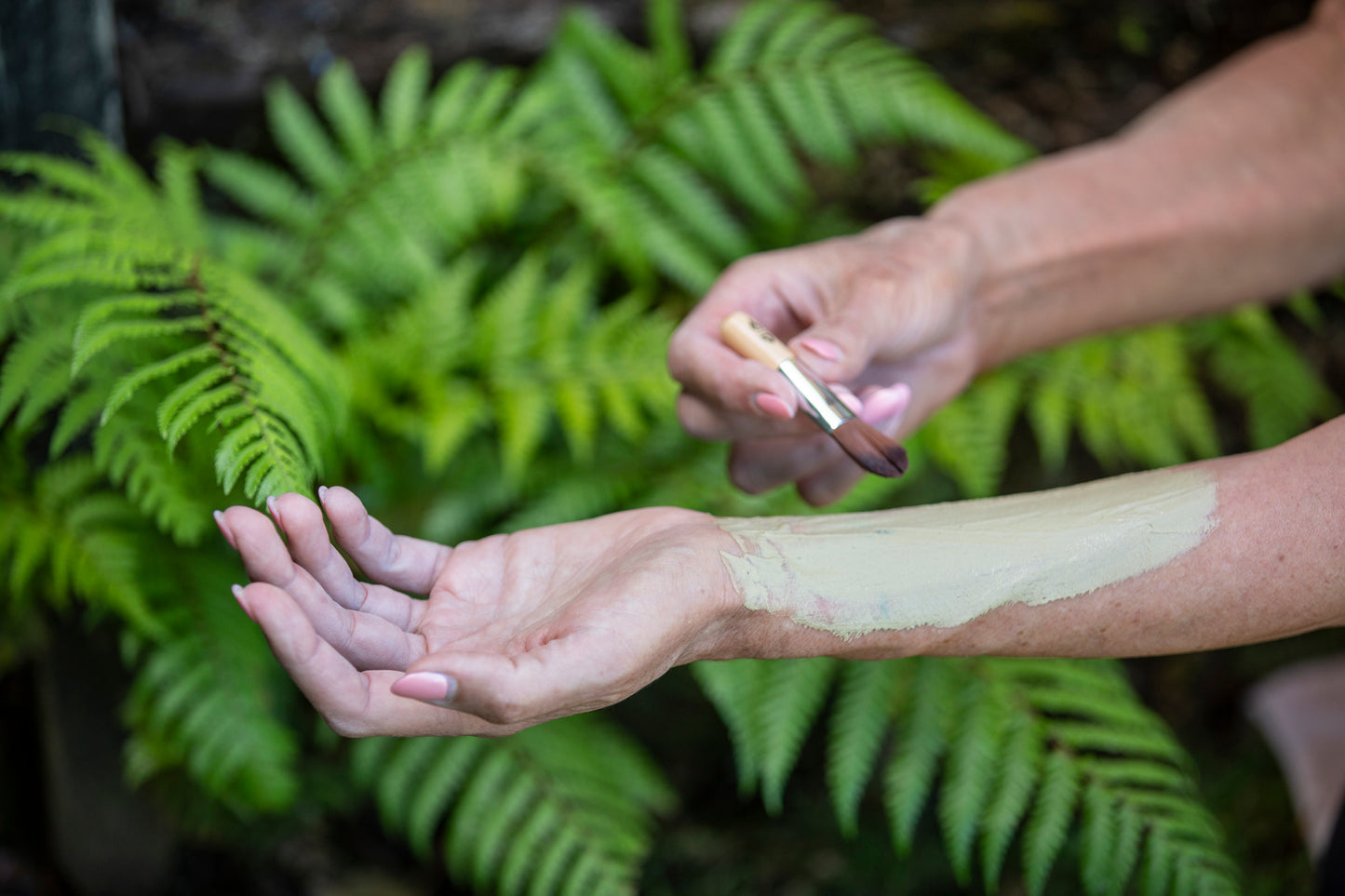 applying mud clay in the hands